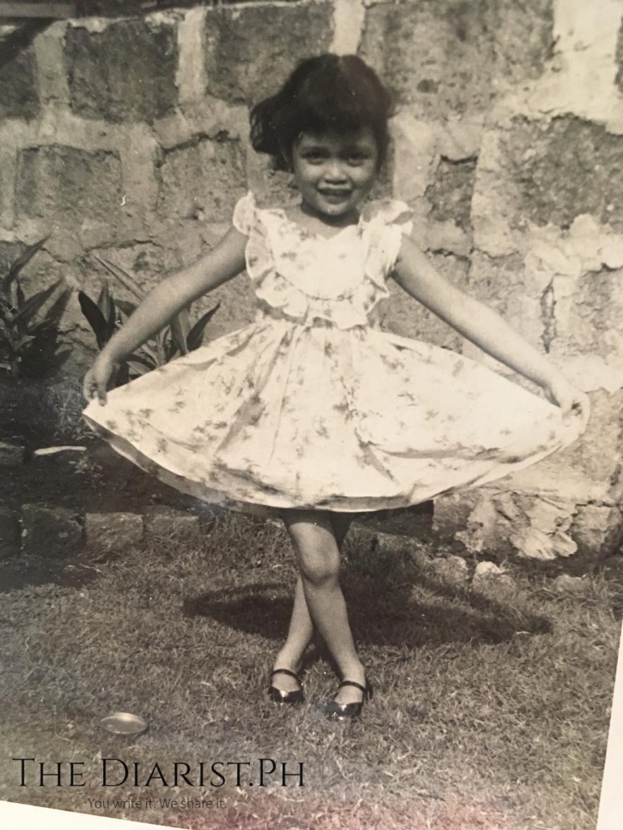 The author as a little girl, showing off her dress