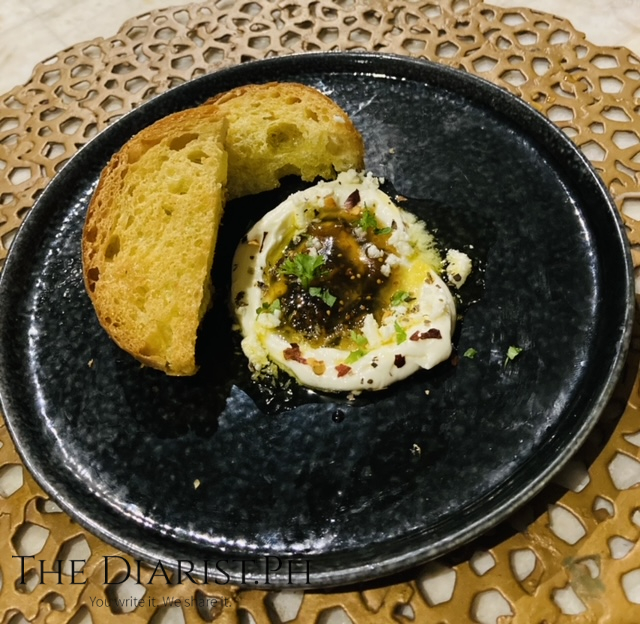 Antonio Me Feta (Creamed feta, Greek fines herbes, roasted garlic, guava fig jam, rosted chili, fried horiatiko bread)